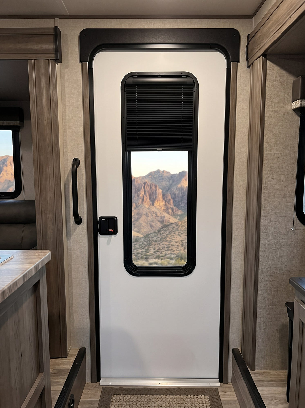Shade covering the top of a tall 12 x 36 RV entry door window