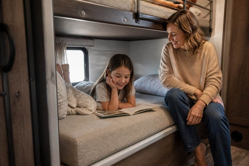 Sandy greige custom bunk mattress in a family travel trailer