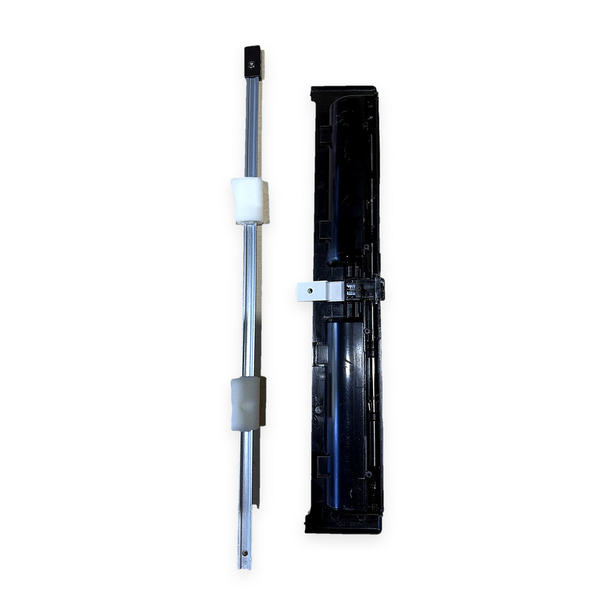 Back of Dometic 4450010427 CRX refrigerator door latch showing spring-loaded mechanism, and latch rod with foam sleeves, on white background