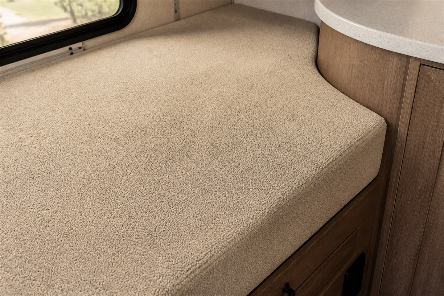 Lifestyle visualization of a custom bunk mattress shaped around curved RV cabinetry