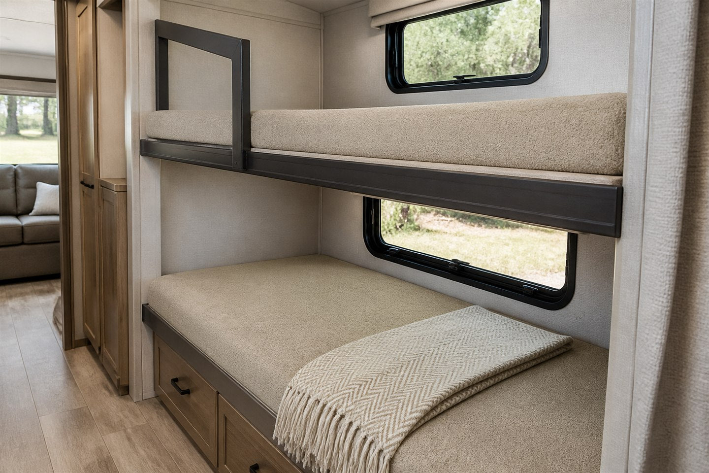 Lifestyle visualization of two custom covered bunk mattresses installed in an RV bunk room